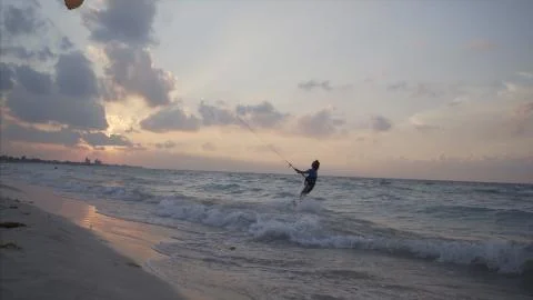 Kiteboard man at sunset Stock Photos