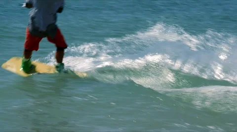 Kiteboarder jumps into the sea Stock Footage 51453353