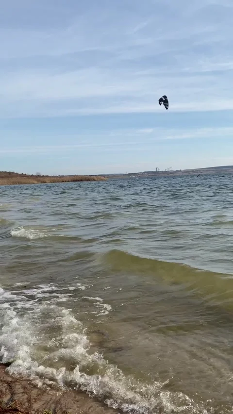 Kiteboarder ketch the wind on sunset Stock Footage 239977680
