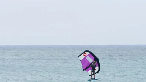 Kitefoiling or hydrofoiling riding Stock Footage 233319930