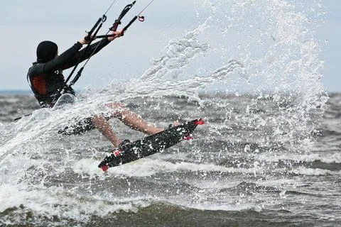 Kiter jumps on the wave Stock-Fotos