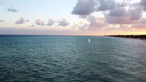 Kiter surfing into sunset 스톡 동영상 165706732