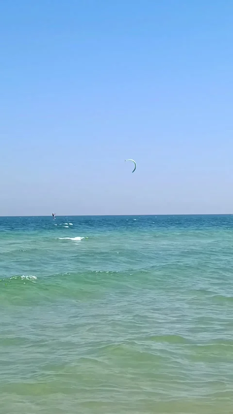 Kiters are having fun in a good wind at the famous Kite Beach, Stock Footage 325987132