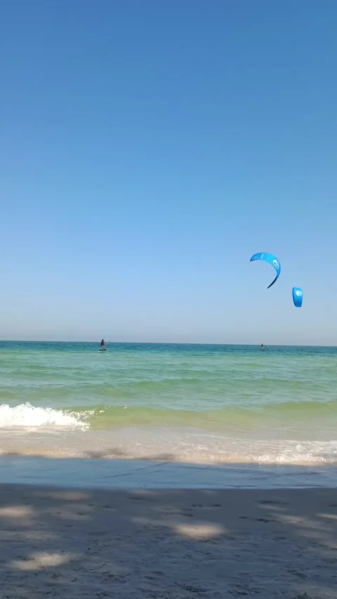 Kiters are having fun in a good wind at the famous Kite Beach, Stock Footage 325987194