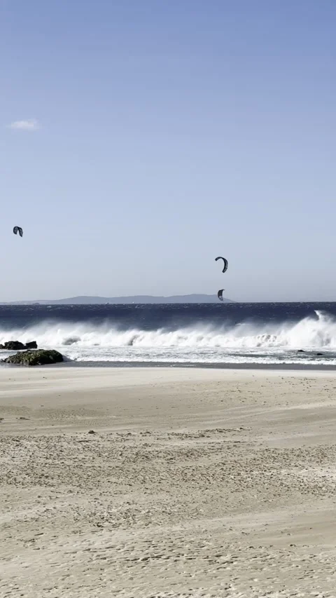 Kites and waves dance on windy Los Lances Beach Tarifa Stock Footage 311053672