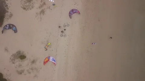 Kites &amp; bicycles laying on the beach Stock Footage 104375008