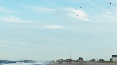 Kites Flying on the Ocean Beach, 4K Stock Footage 53134617