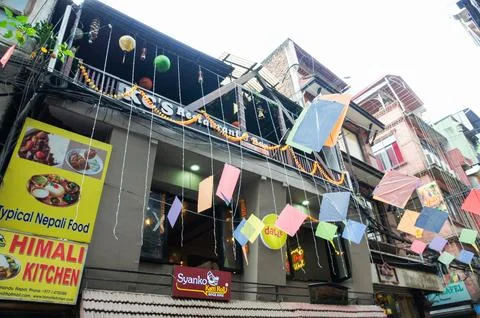 Kites in front of a building. Stock Photos