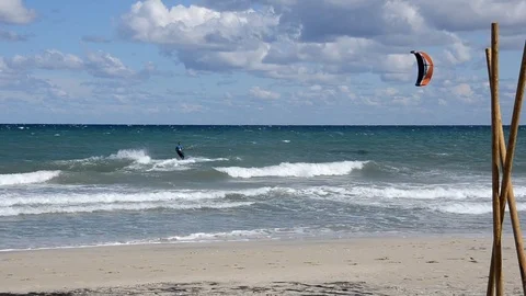 Kitesurfer in action on a windy day Stock Footage 82612565