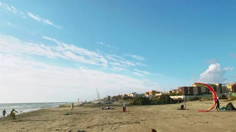 Kitesurfer on the crest of a wave. Blue sky with white clouds. Seascape with Stock Footage 162506516