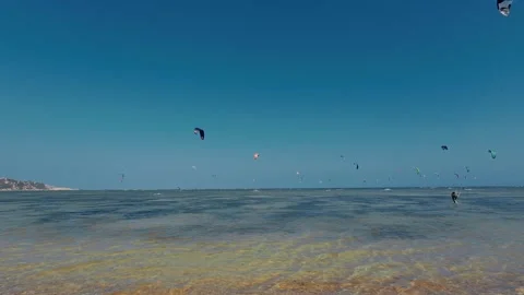 Kitesurfer Flying Black Kite over Shallow Ocean Waters Stock-Footage 340463056
