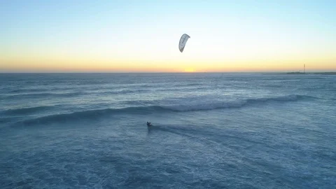 Kitesurfer Jumps Over The Waves At Sunset Stock Footage 99139864