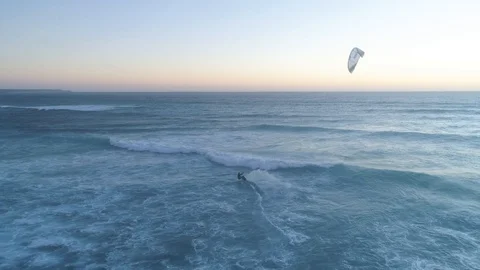 Kitesurfer Jumps Over The Waves At Sunset Stock Footage 99139866