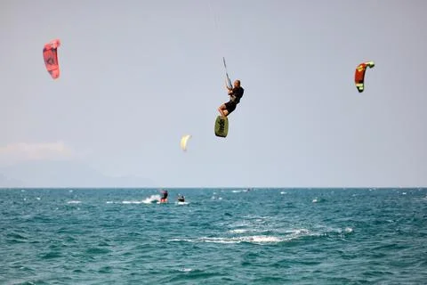 Kitesurfer performs a high Big Air jump over the sea in Nha Trang, Vietnam Stock Photos