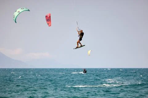 Kitesurfer performs a high Big Air jump over the sea in Nha Trang, Vietnam Stock Photos