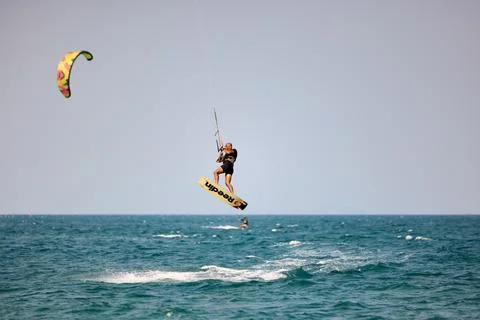 Kitesurfer performs a high Big Air jump over the sea in Nha Trang, Vietnam Stock Photos