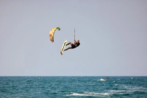 Kitesurfer performs a high Big Air jump over the sea in Nha Trang, Vietnam Stock Photos