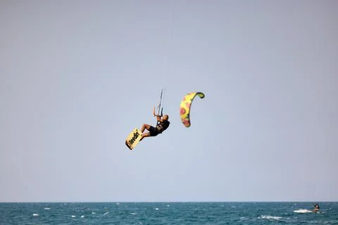 Kitesurfer performs a high Big Air jump over the sea in Nha Trang, Vietnam Stock Photos