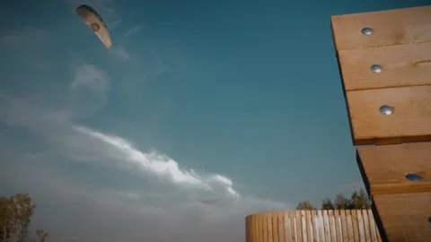 Kitesurfer practicing with kite on land, training for water sports. Slow motion Stock Footage 292868819