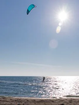 The kitesurfer rides the waves Stock Photos