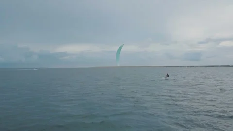 Kitesurfer sails at speed in the sea. Extreme sport Stock Footage 95032142