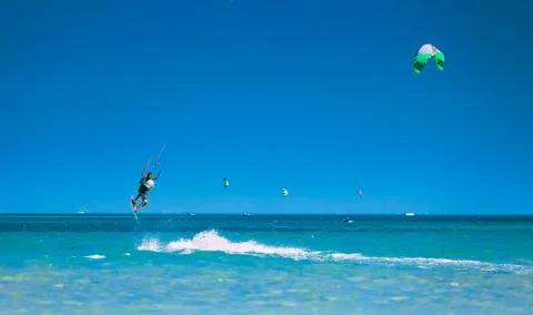 The kitesurfer soaring in the sky over the Red sea Stock Photos