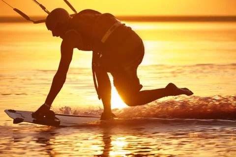 Kitesurfer at sunset 写真素材
