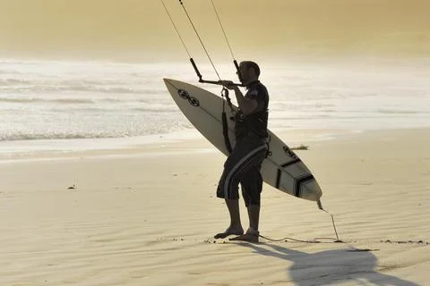 Kitesurfer with surfboard Stock Photos
