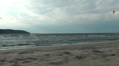 Kitesurfing on the beach, Sandy HOOK area cloudy and chilly day, but some people Stockbeeldmateriaal 56461610