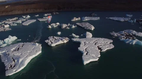 KITESURFING IN BETWEEN ICEBERG Stock-Footage 67612044