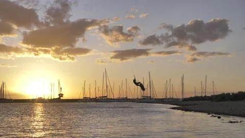 Kitesurfing at sunset in slow motion Stock Footage 139847659