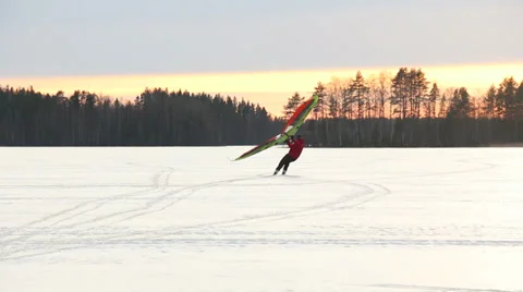 Kitewing skiing on ice-covered lake Stock Footage 36072234