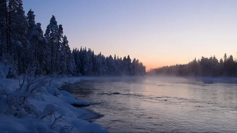 Kiveskoski river in winter on a cold evening at -30º Centigrade with mist Video stock 104210858