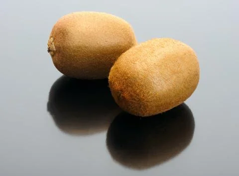 Kiwi on a black background Stock Photos