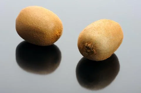 Kiwi on a black background Stock Photos