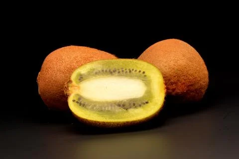 Kiwi on black background Fotos de archivo
