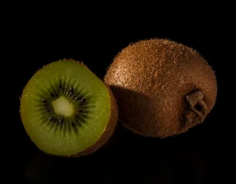 Kiwi on black background Stock Photos