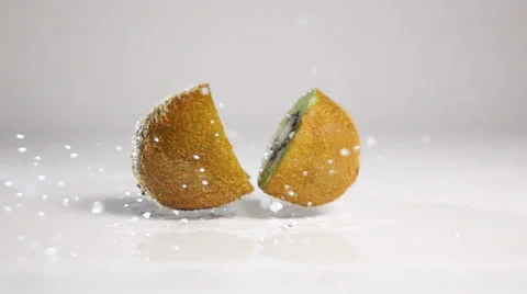 Kiwi break on two halves on white surface Stock Footage 63093682