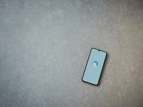 Kiwi Browser app launch screen with logo on the display of a black mobile sma Stock Photos