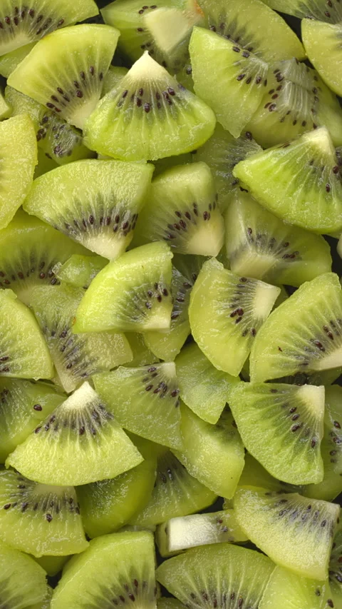 Kiwi chunks background. Stock Footage 308076245