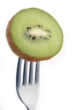 Kiwi on fork Stock Photos
