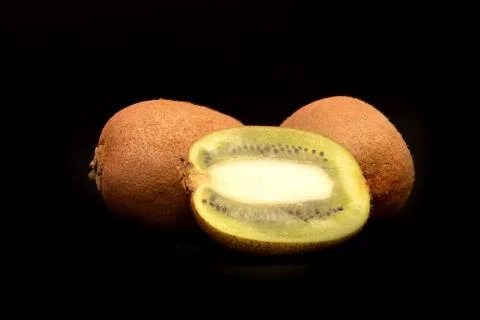 Kiwi fruit on black blackground Stock Photos