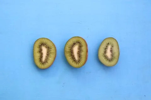Kiwi fruit on blue table Stock Photos