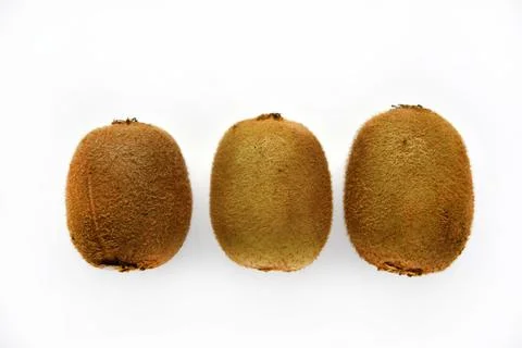 Kiwi fruit fruit on a white background close-up. Delicious green kiwi. Stock Photos