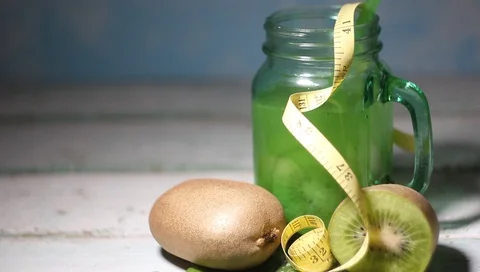 Kiwi Fruit Kiwi-based Drink, Measuring Tape as a Concept Diet Video stock 101407374