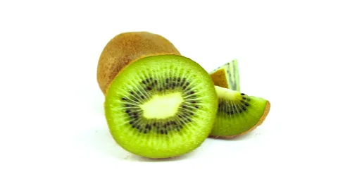 Kiwi fruit rotating on a white Stock Footage 63675251
