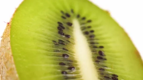 Kiwi fruit slice texture. Rotation on a white background. Stock Footage 162405353
