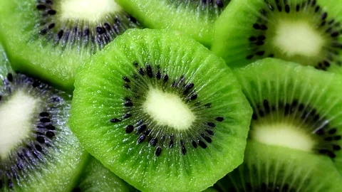 Kiwi Fruit Slices Rotating Vídeos de archivo 74940649
