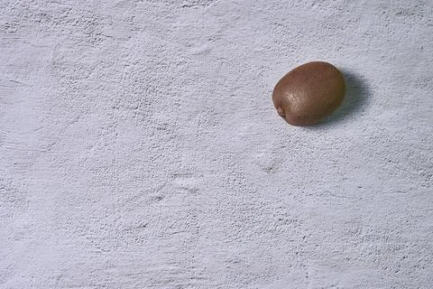 A kiwi fruit on a stone Stock Photos