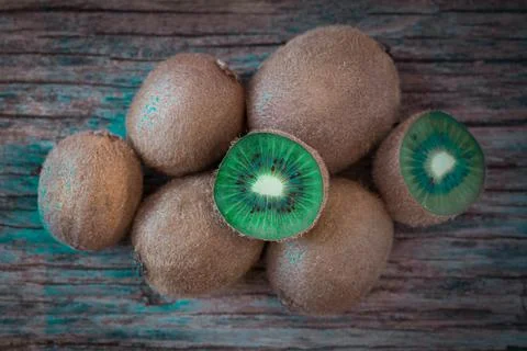 Kiwi fruit on wooden rustic table, ingredient for detox smoothie Stock Photos